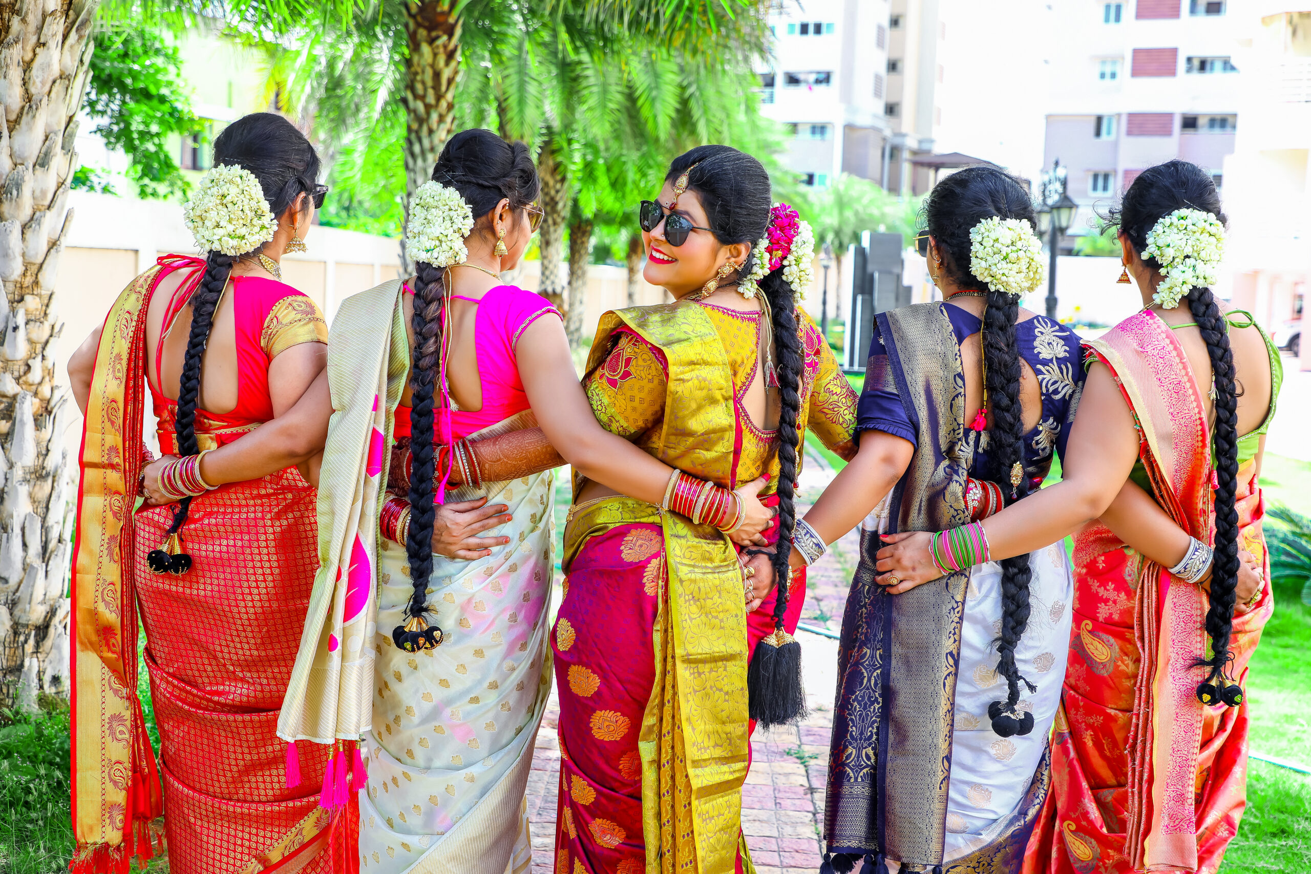 A group of women in colorful saris at Gayathri's Maternity Photoshoot by ak photography coimbatore.
