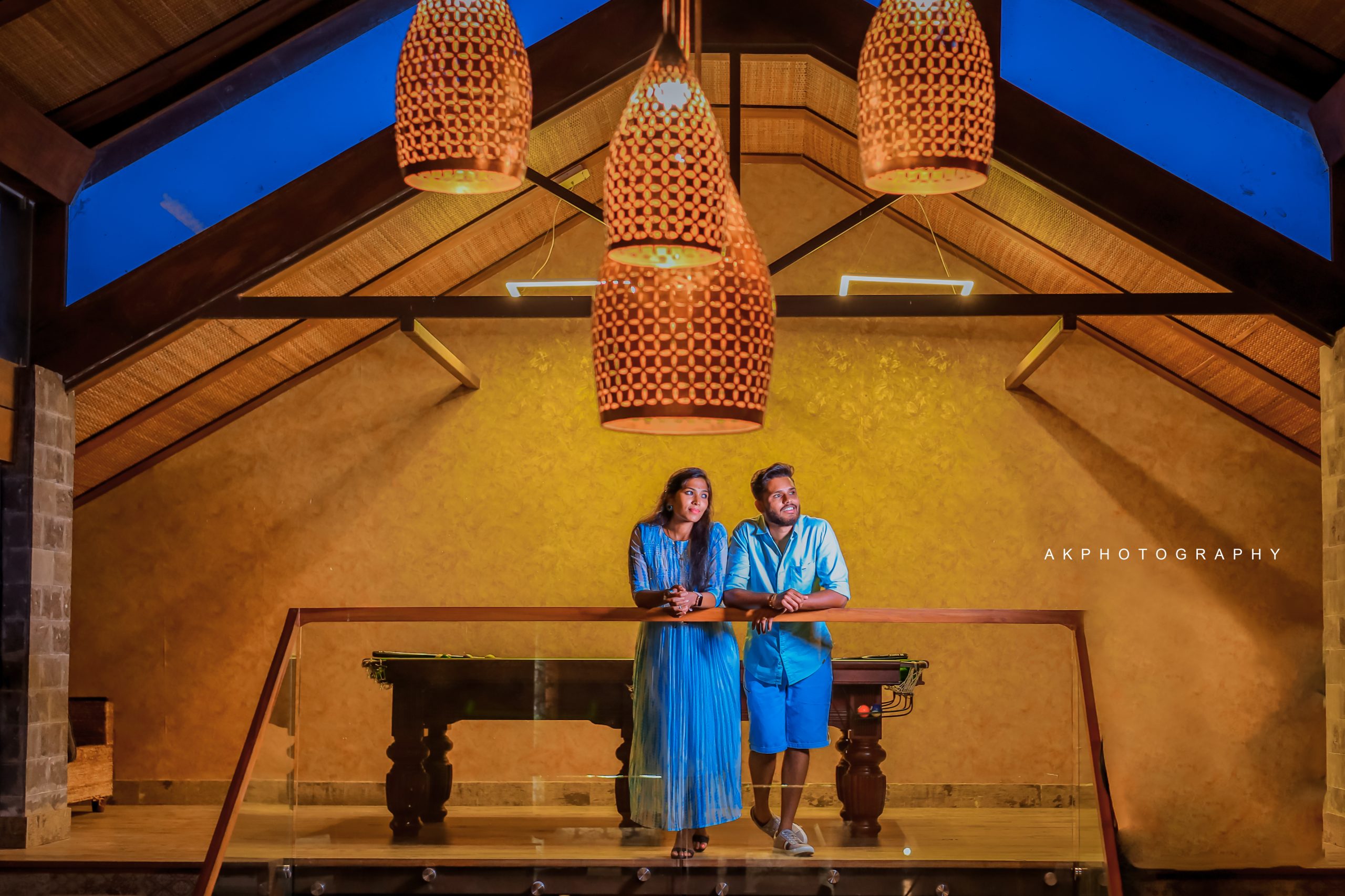 Resorts in Ooty for the Perfect Photoshoot: AK Photography's Ultimate Guide A couple posing in front of a chandelier. Enchanting Pre-Wedding Couple Shoot of Krishna & Nivetha in Ooty,