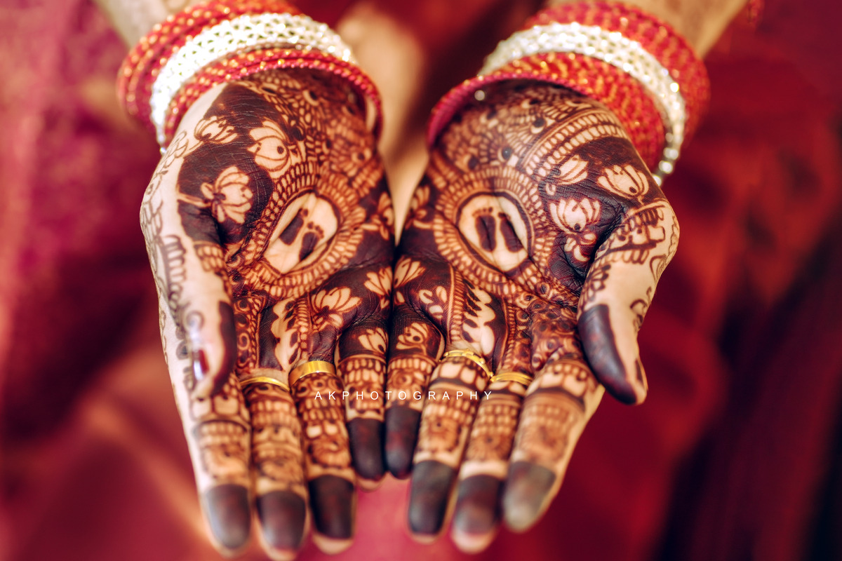 Carolene's Baby Shower: Beautifully adorned hands with henna designs, showcasing cultural elegance.