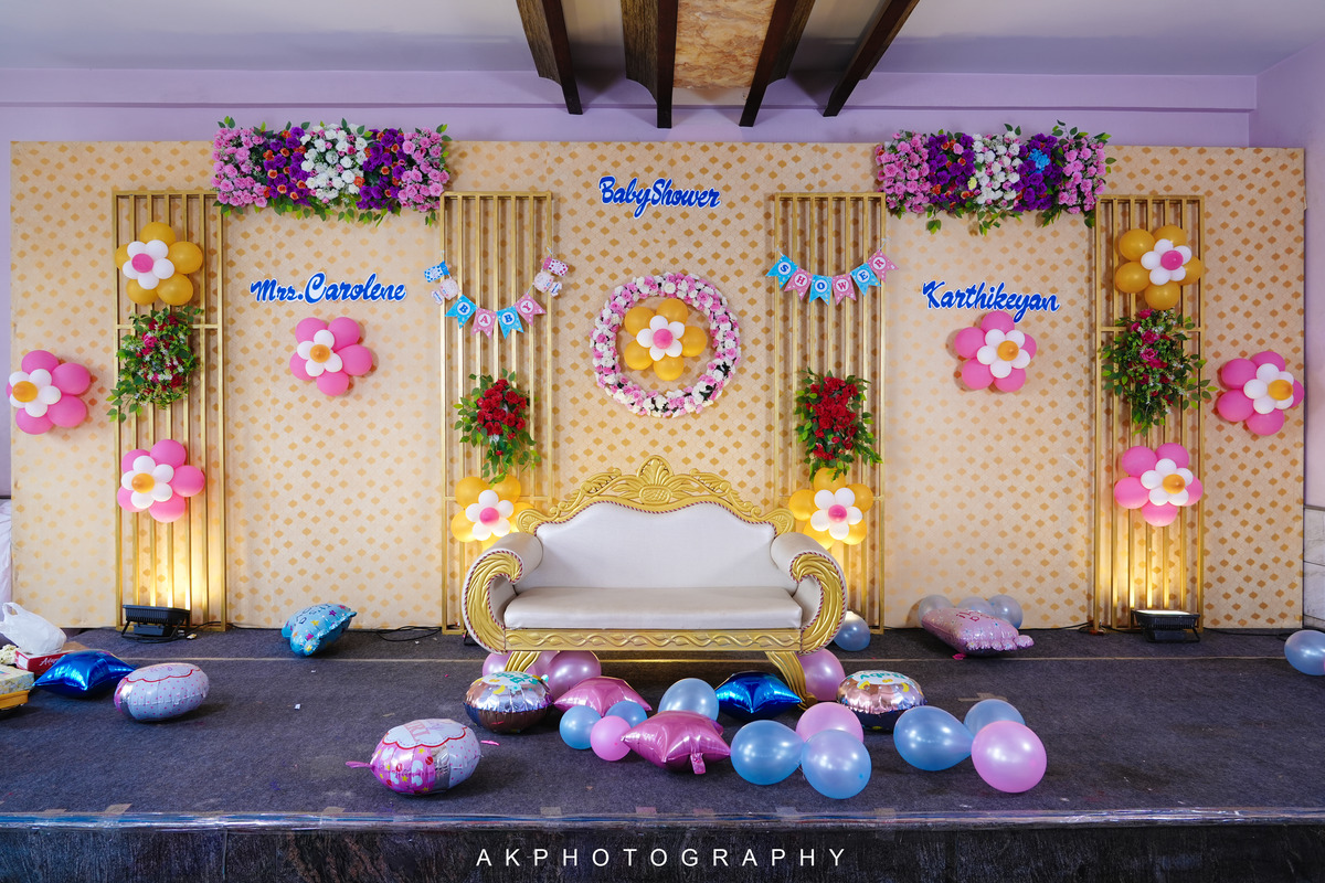 Colorful balloons and flowers adorn a birthday party, captured in a Baby Shower Photoshoot by AK Photography."