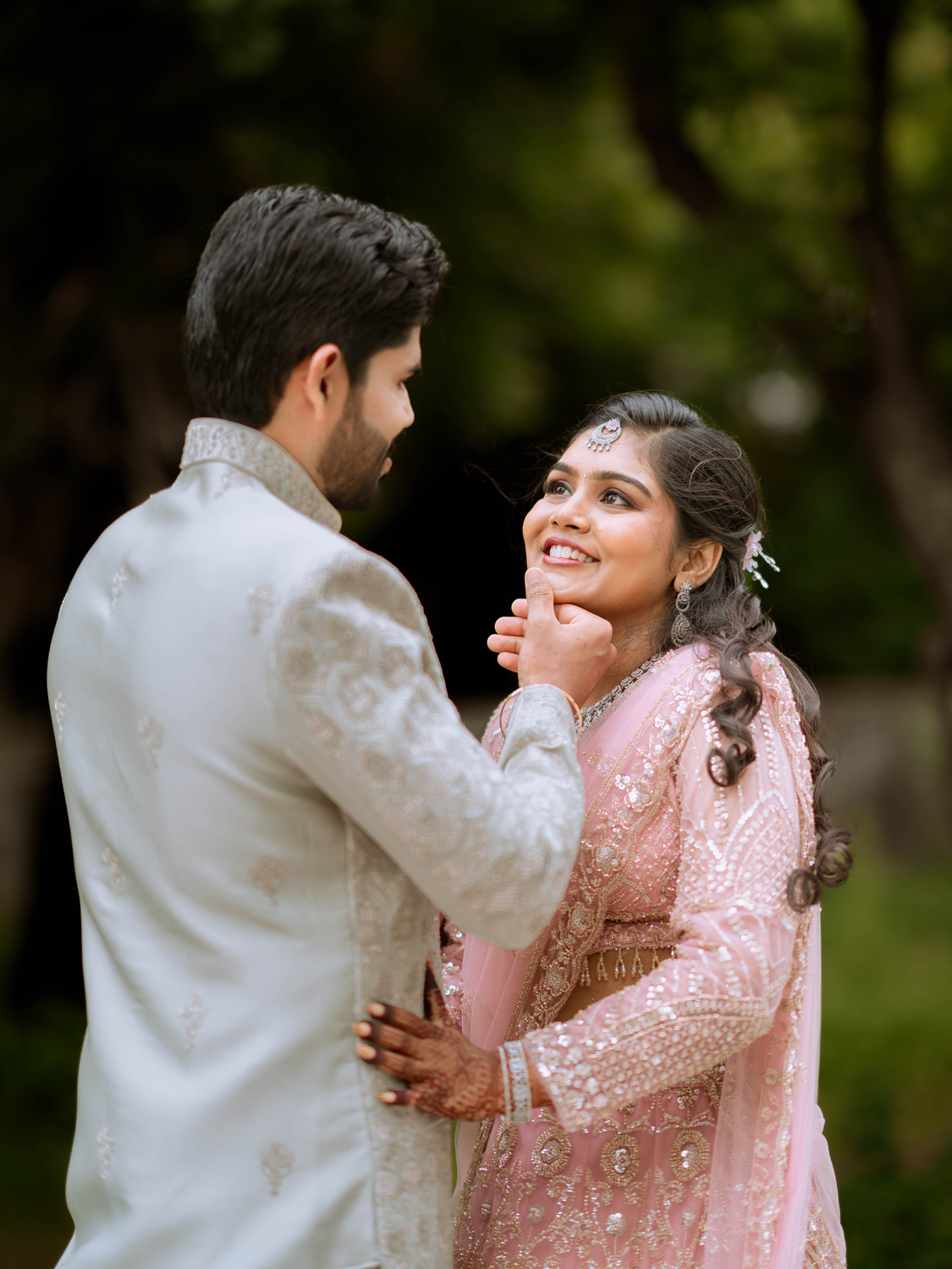 Joyful candid smiles and laughter of couple Mohan and Narmadha during wedding reception