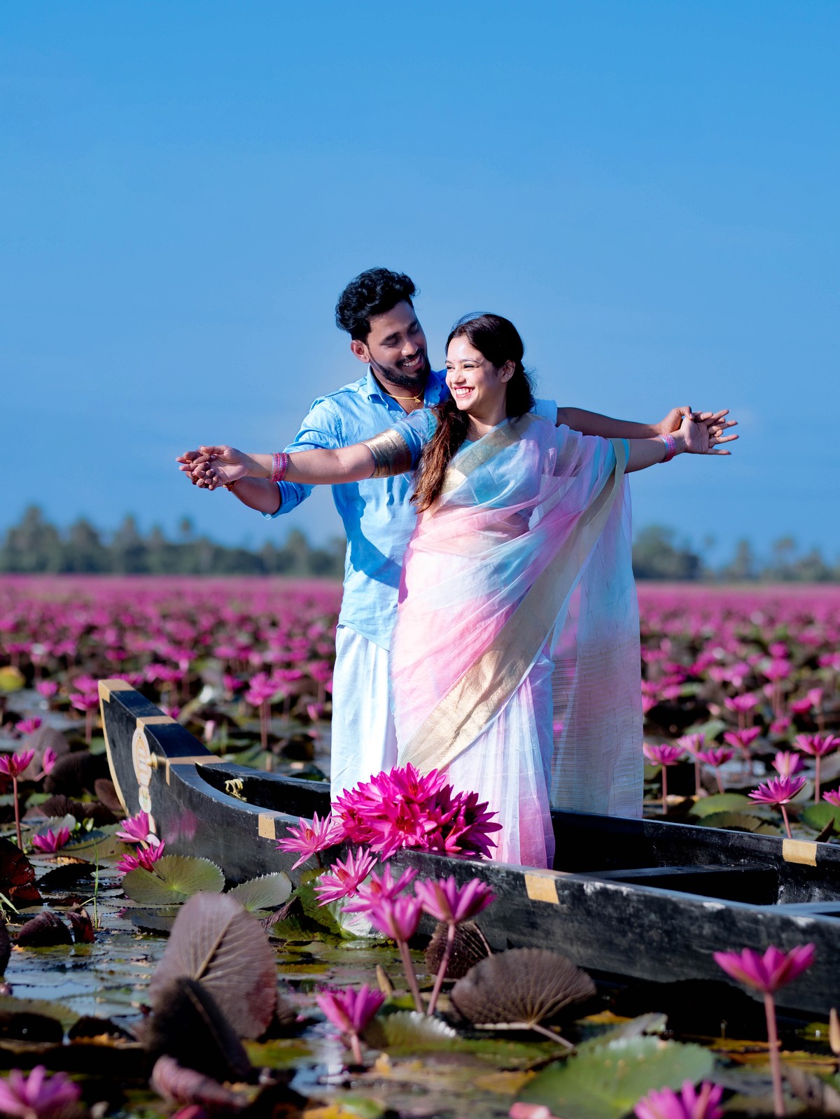 Romantic Titanic standing pose on boat at Malarikal water lily lake with Shneka and Deepak by AK Photography
